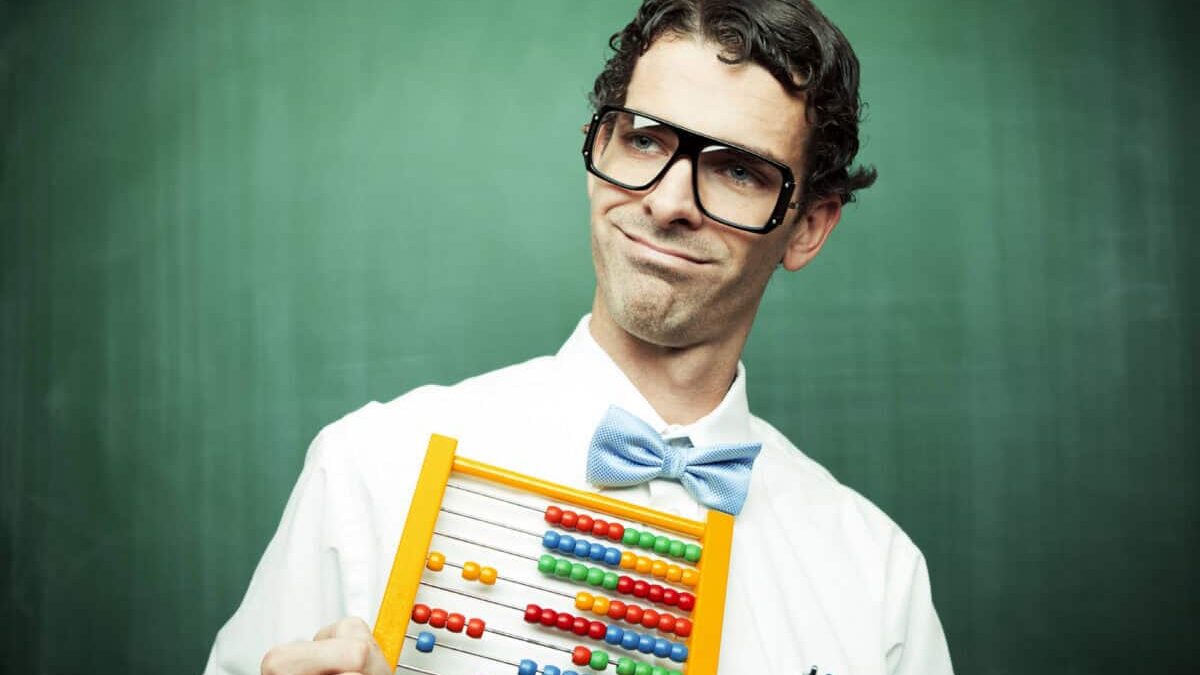 man in bowtie poses with abacus